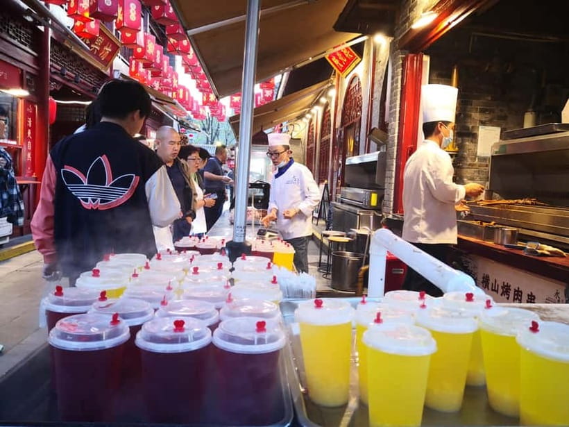 Authentic Old Xi'an Back Alley Food Tour - Open kitchens turn eating into a small lesson