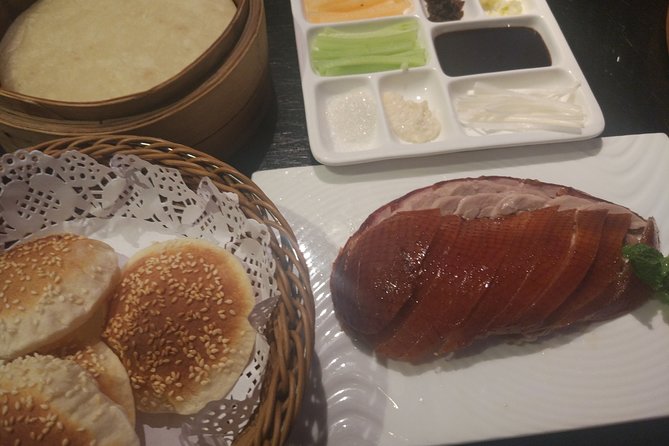 Beijing Evening Tour: Chaoyang Acrobatic Show with Peking Duck Dinner - From your hotel lobby to the theater
