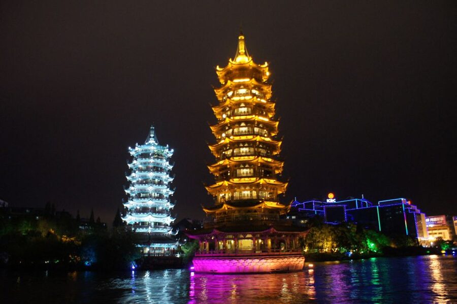 Guilin: Four Lakes Night Cruise with Round-trip Transfer - Boarding a boat with open city views