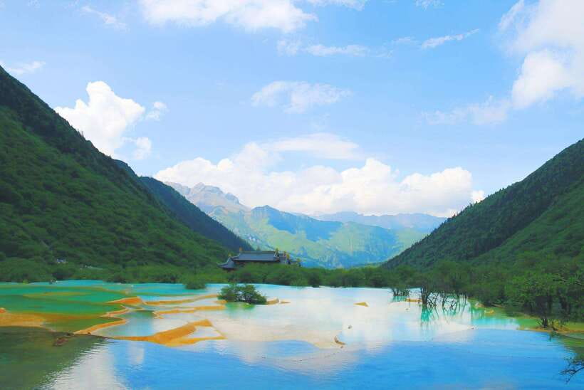 Huanglong Scenic Area: Explore Stunning Five-Colored Ponds - Golden Sand Pavement and the Travertine Flow
