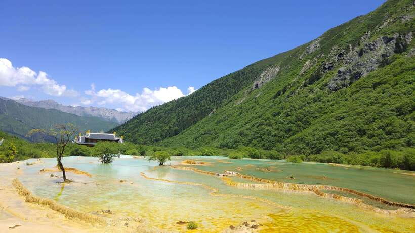 Huanglong Scenic Area: Explore Stunning Five-Colored Ponds - Mountains, Forest, and Water Along the Route