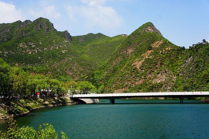 Longqing Gorge Self-Guide Trip with Private English Speaking Driver - Seeing the Longqing Dam between the hills