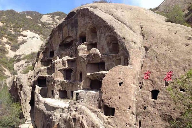Private Transfer to Longqing Gorge and Guyaju Caves Excursion by English Driver - Longqing Gorge: water, rock, and open views