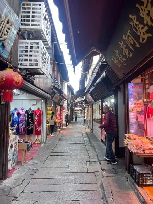 Shanghai: Zhujiajiao Water Town with Calligraphy Experience - Taking the traditional boat ride