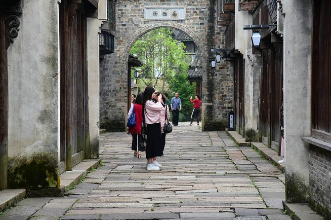Wuzhen and Xitang Water Town Private Full Day Trip from Shanghai with Lunch and Dinner - Wuzhen by daylight: canals, bridges, and old lanes