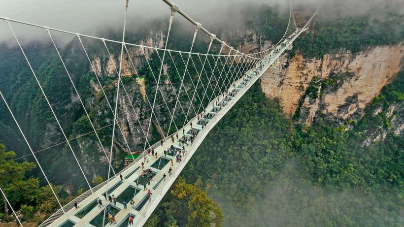 Zhangjiajie: Highlights Tour with Glass Bridge & Cable Car - Crossing Zhangjiajie Glass Bridge above the canyon